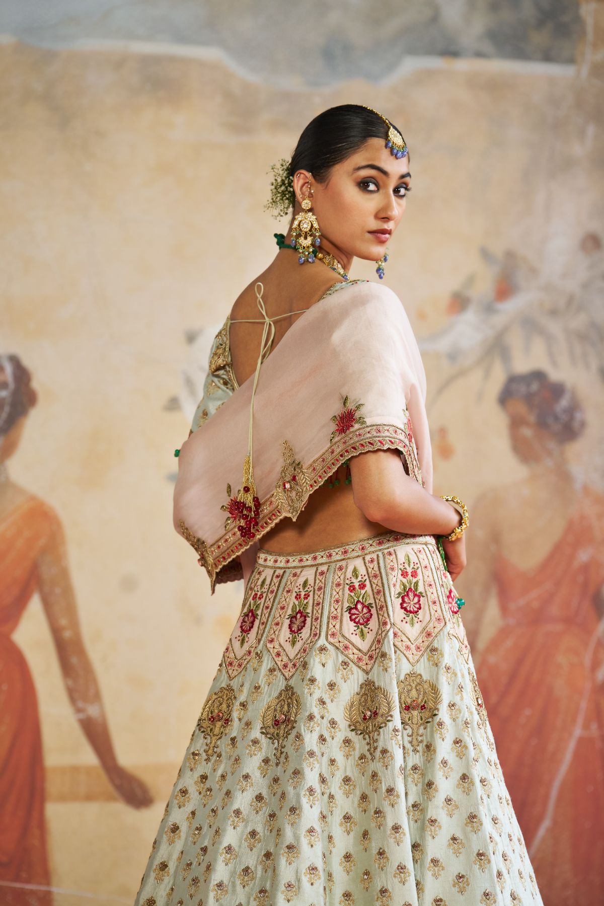 Green zardozi lehenga set.