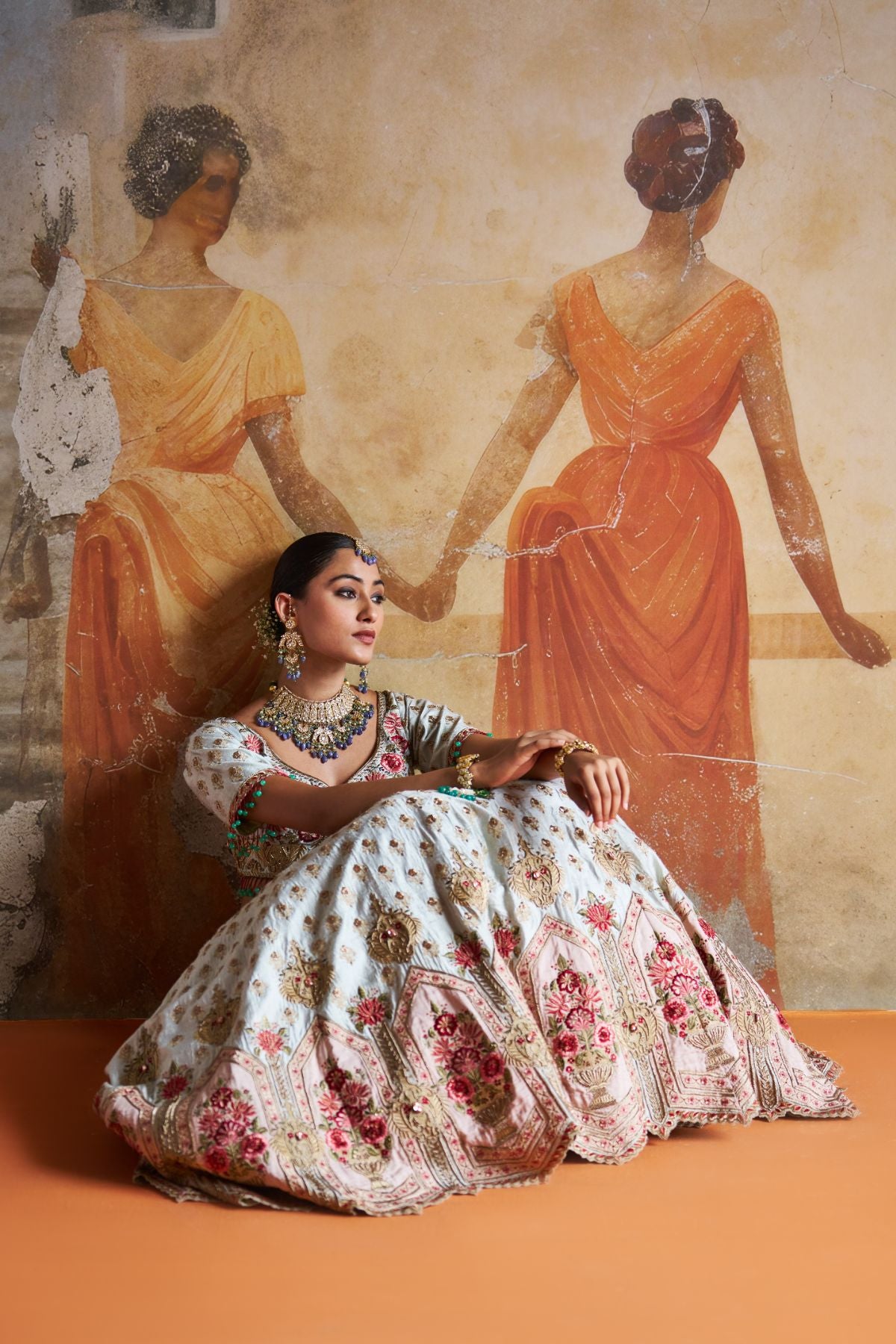 Green zardozi lehenga set.