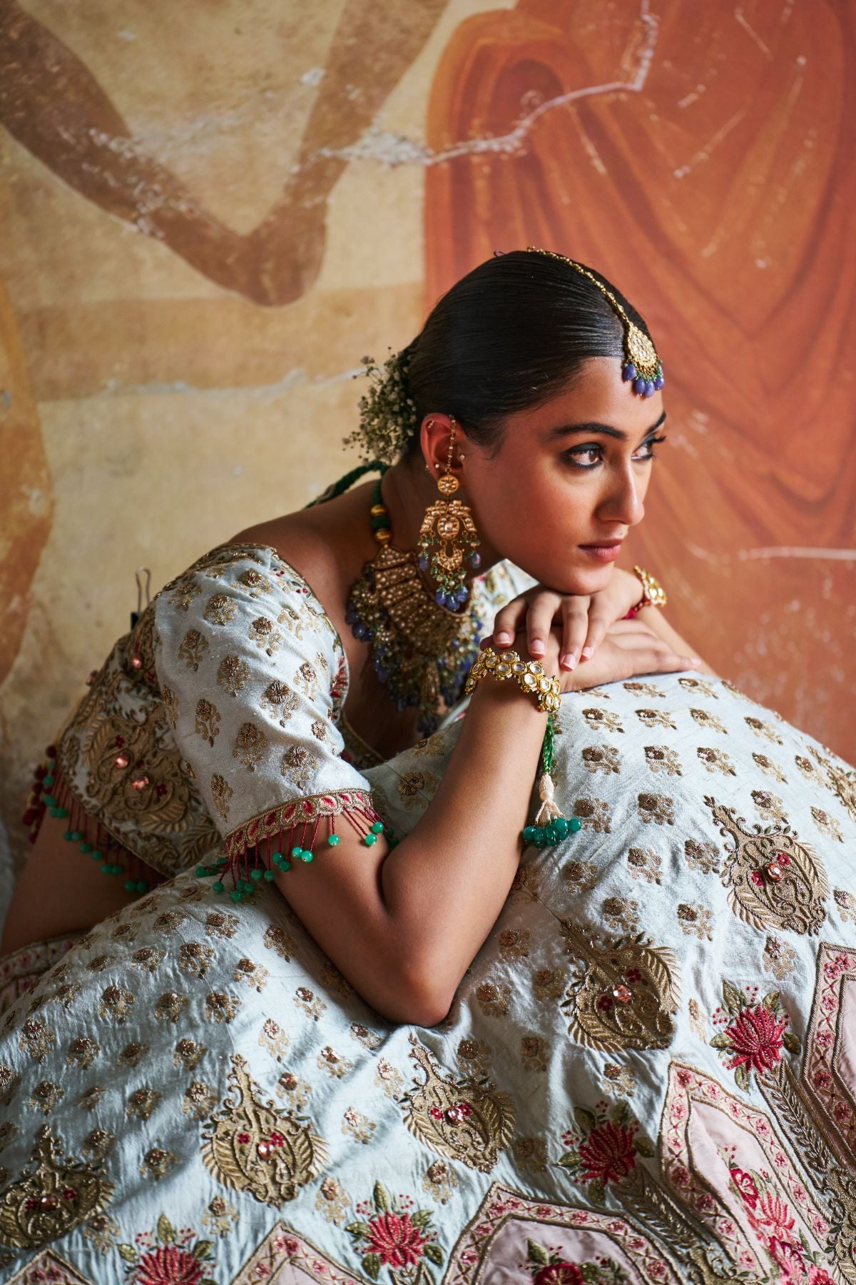 Green zardozi lehenga set.