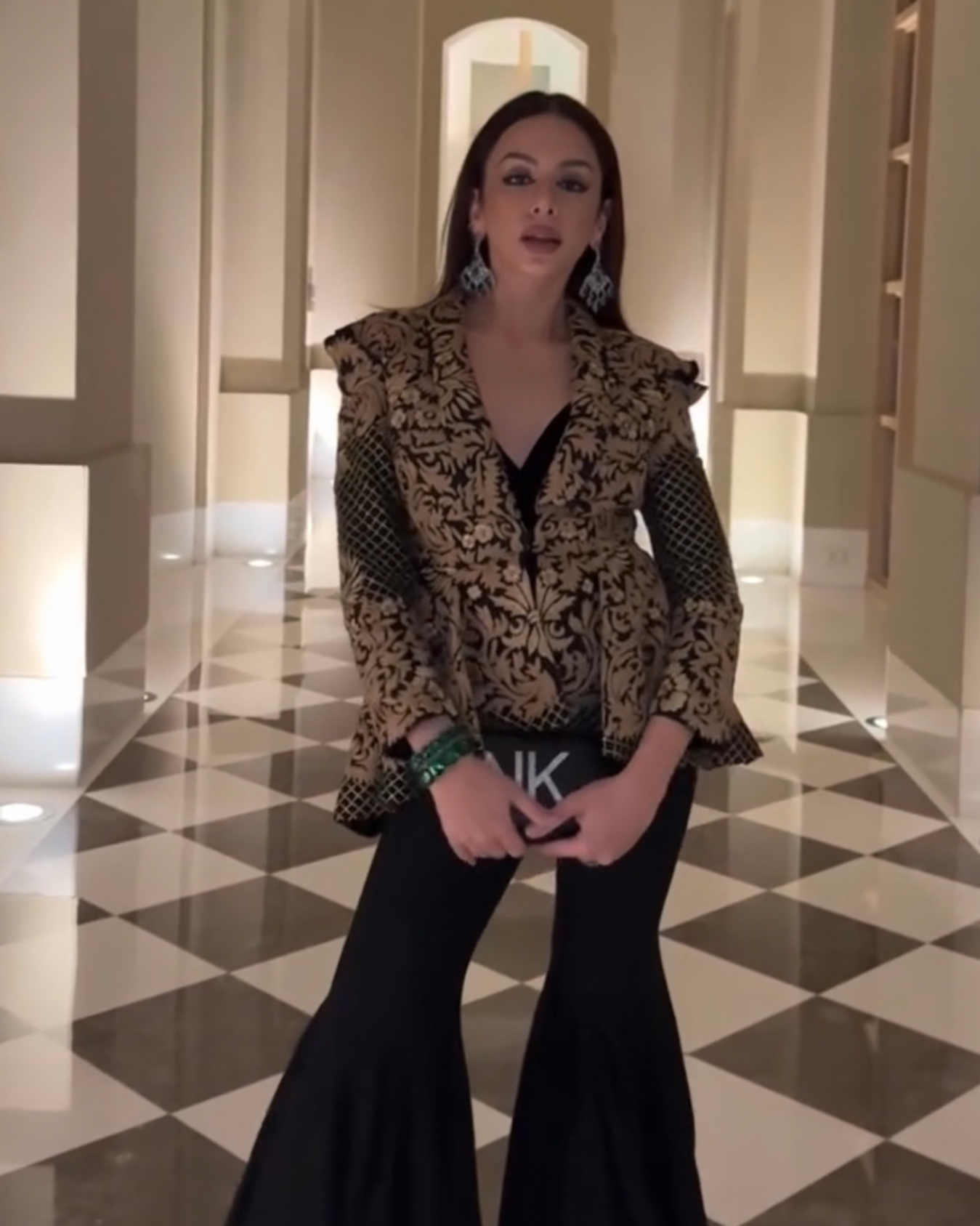 Nitibha Kaul in Zoe black peplum jacket