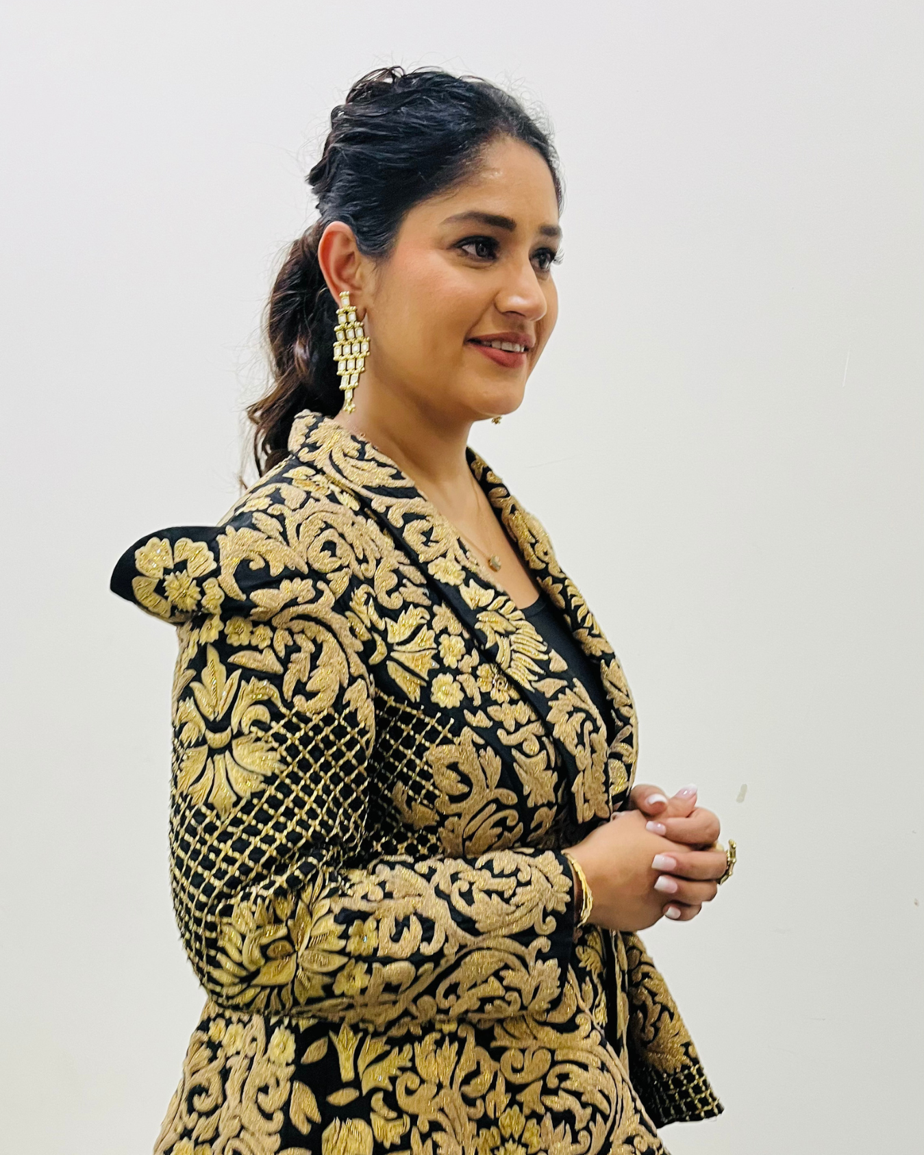 PRATIBHA SINGH in Zoe black peplum jacket set.