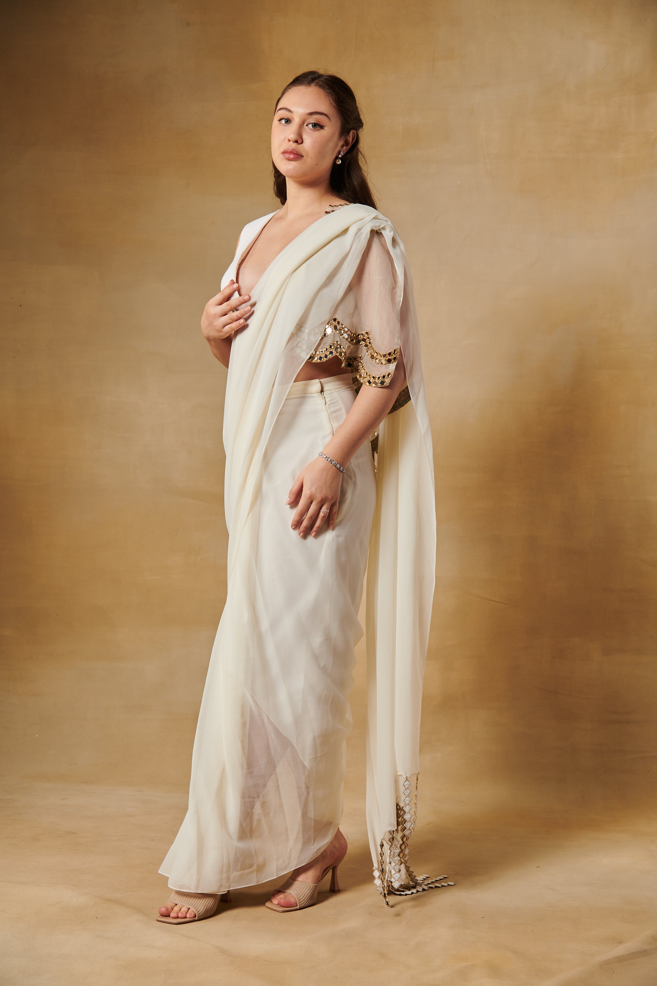 Rukmini Maitra in ivory pre draped mirror cape saree