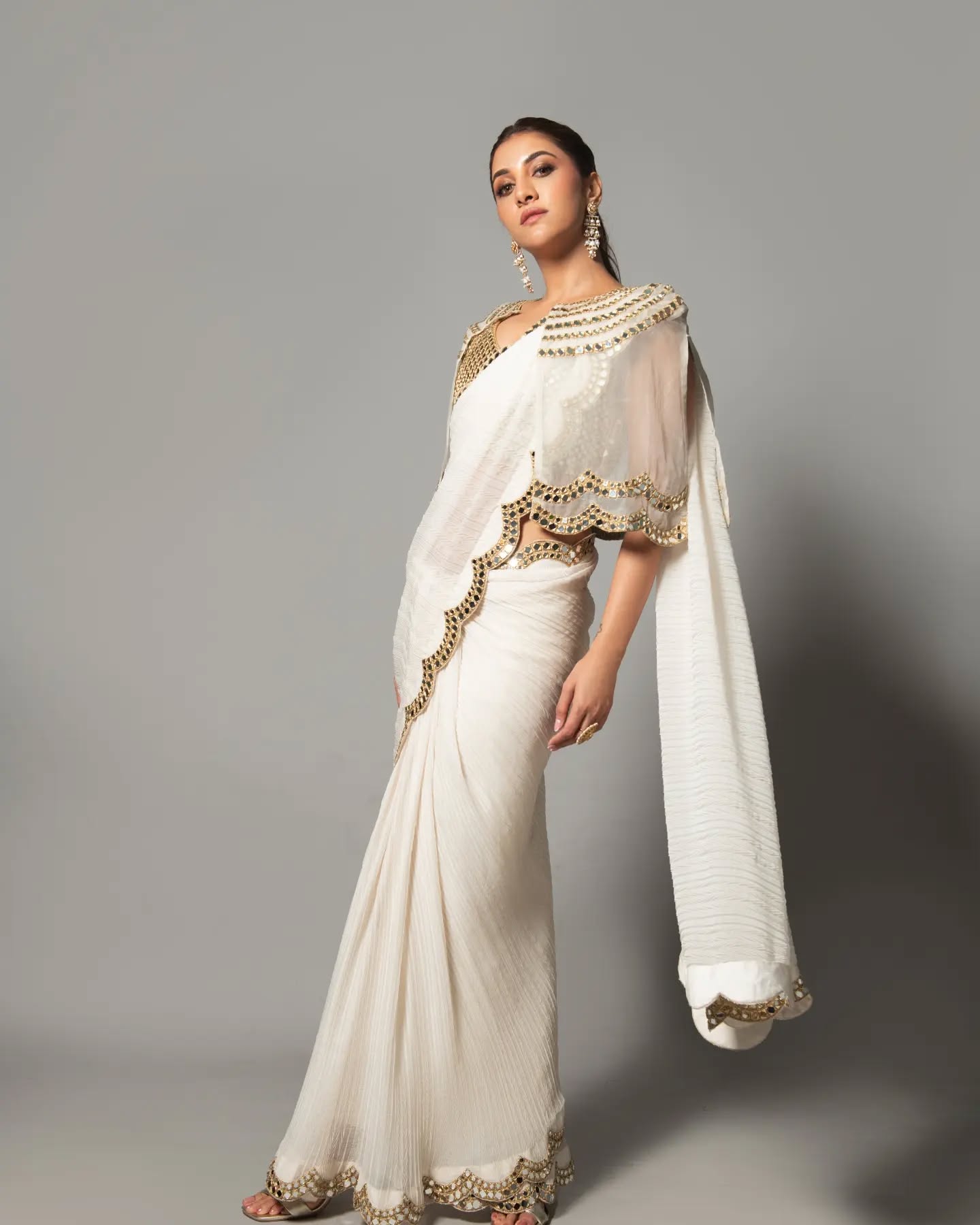 Rukmini Maitra in ivory pre draped mirror cape saree