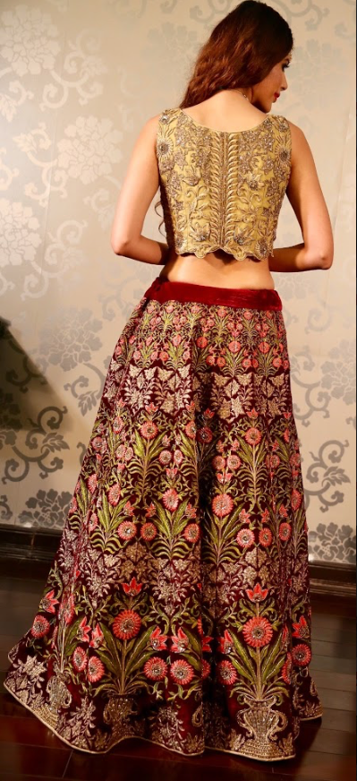 Heavy Embroidered velvet lehenga with a gold blouse