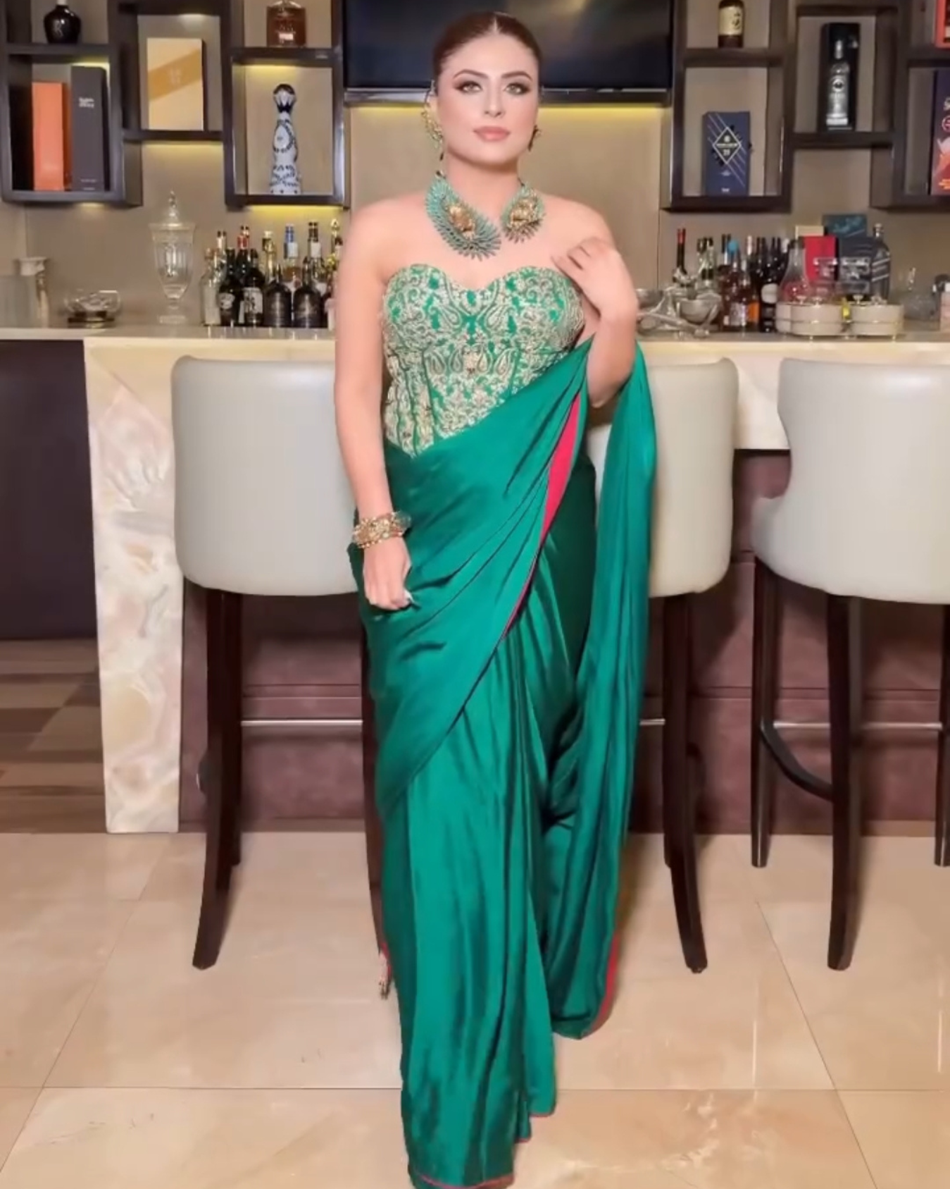 Aastha Nagpal in EMERALD GREEN HEAVY CORSET DRAPED SAREE SET