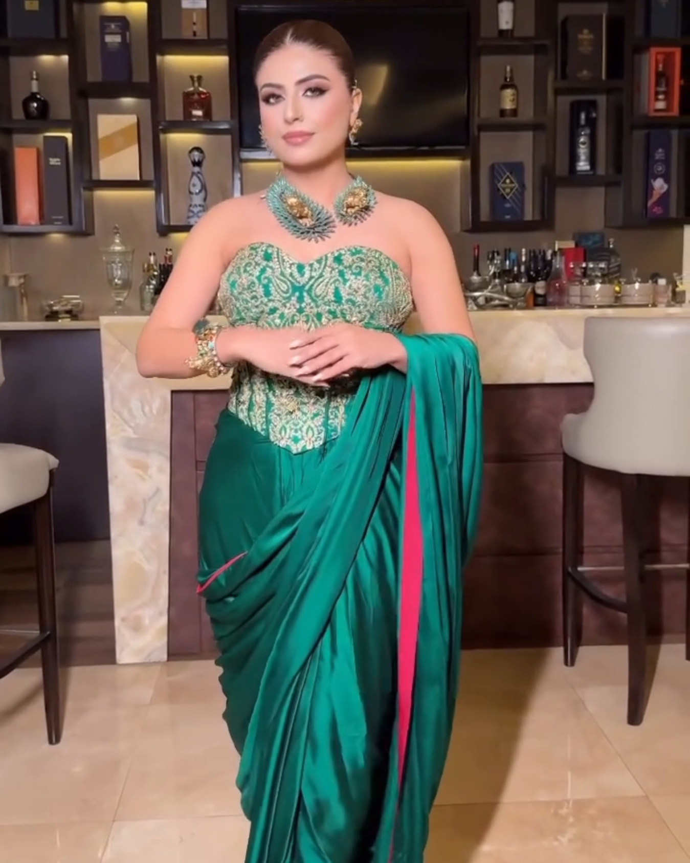Aastha Nagpal in EMERALD GREEN HEAVY CORSET DRAPED SAREE SET