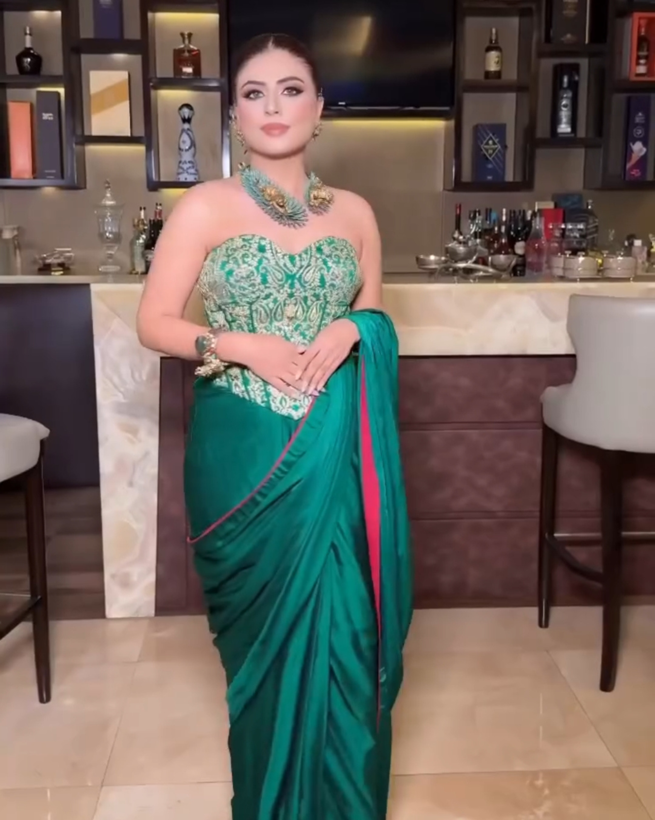 Aastha Nagpal in EMERALD GREEN HEAVY CORSET DRAPED SAREE SET