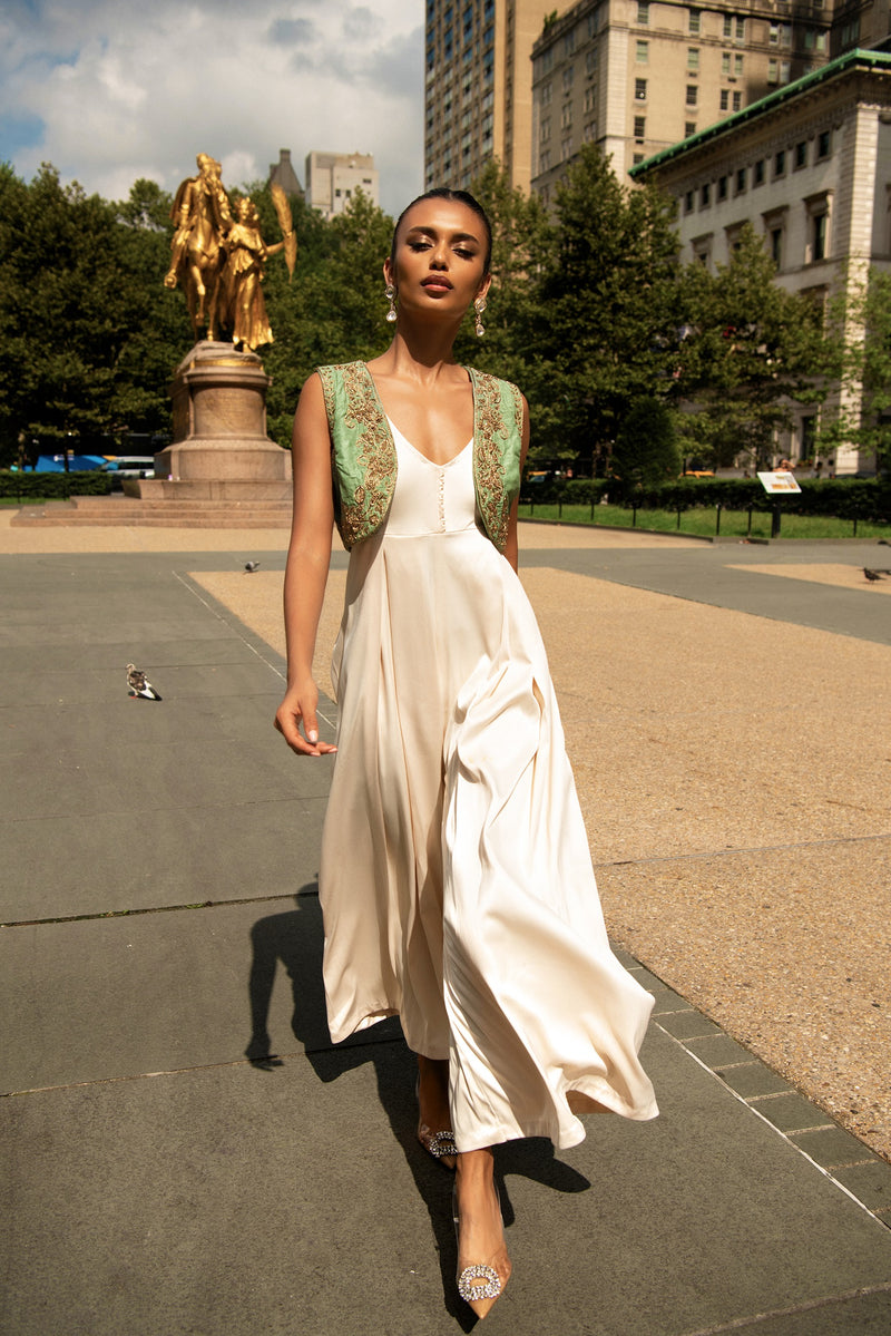 Ivory flared jumpsuit with embroidered jade green bolero
