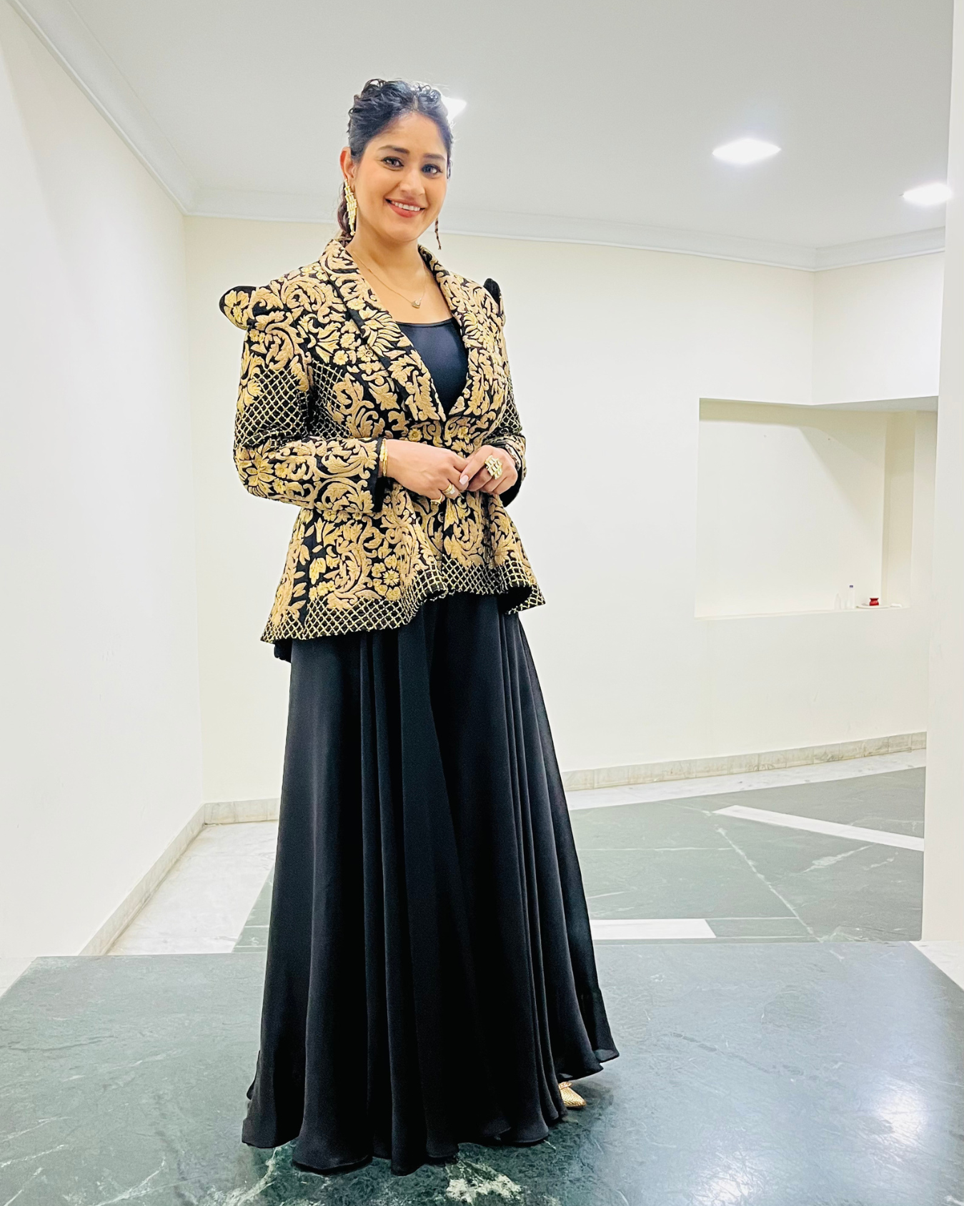 PRATIBHA SINGH in Zoe black peplum jacket set.