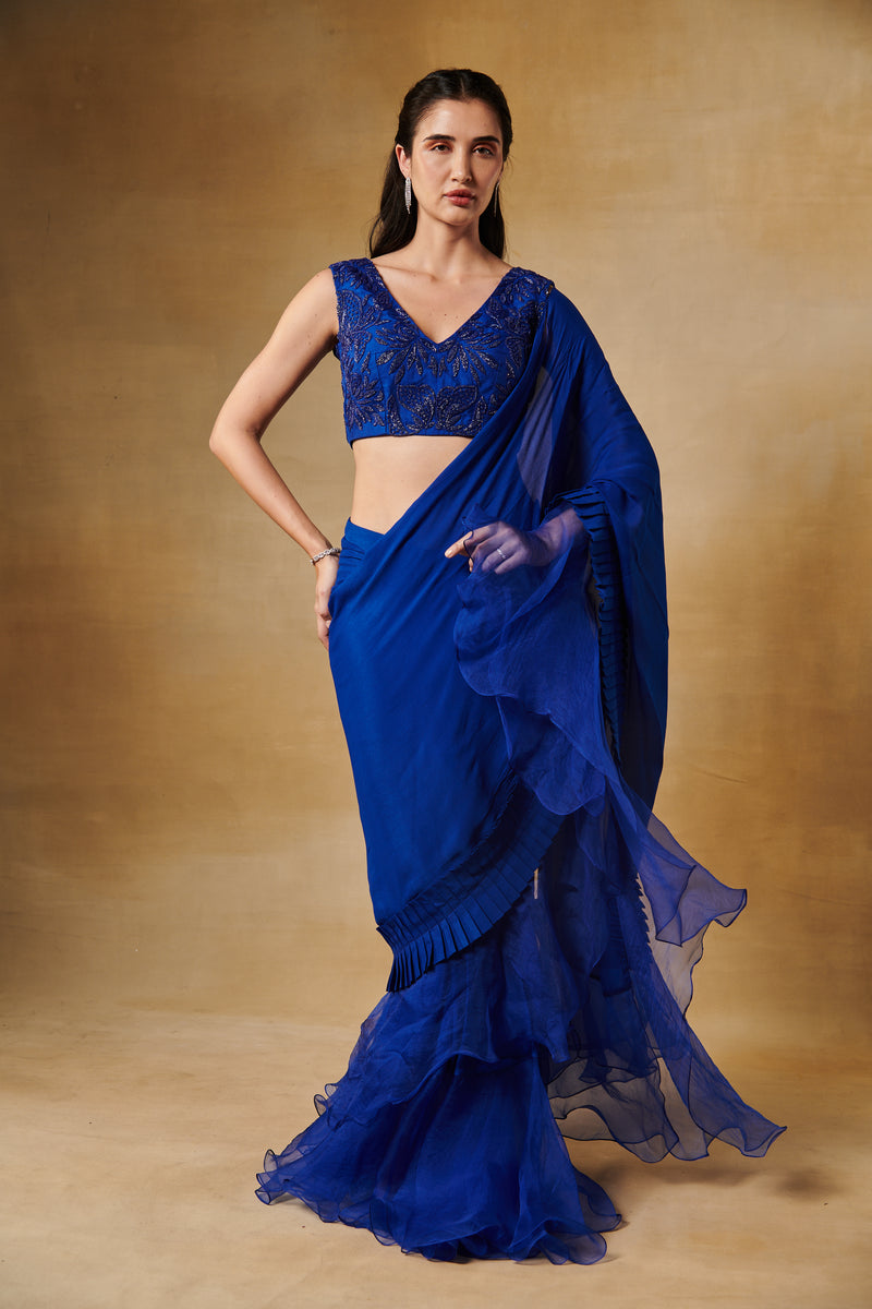 Electric blue beaded blouse with a pleated border saree