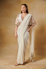 Shell white pre draped saree set layered with mirror work cape.