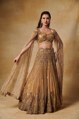 Vintage gold heavy hand embroidered lehenga set  with long cape sleeves