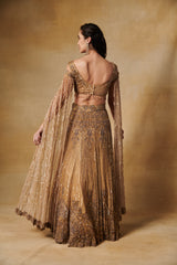 Vintage gold heavy hand embroidered lehenga set  with long cape sleeves