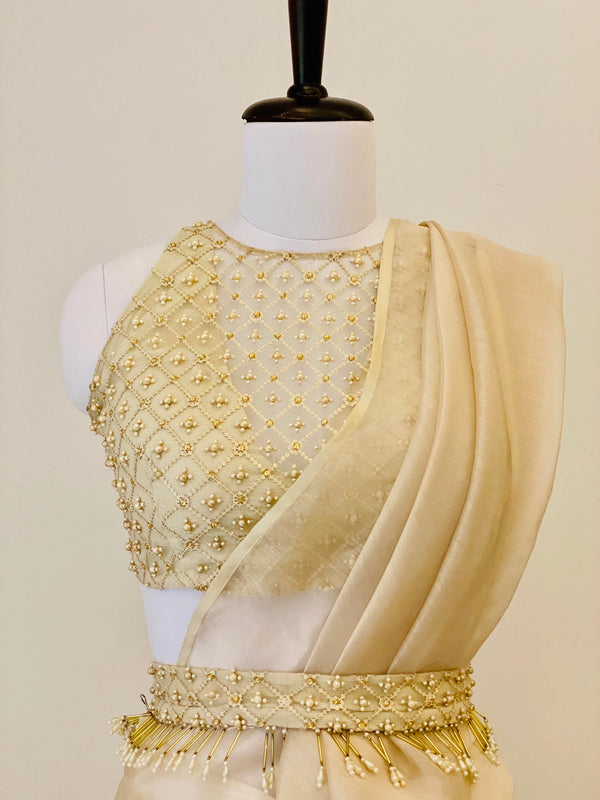Champagne drape saree with pants and pearl work belt