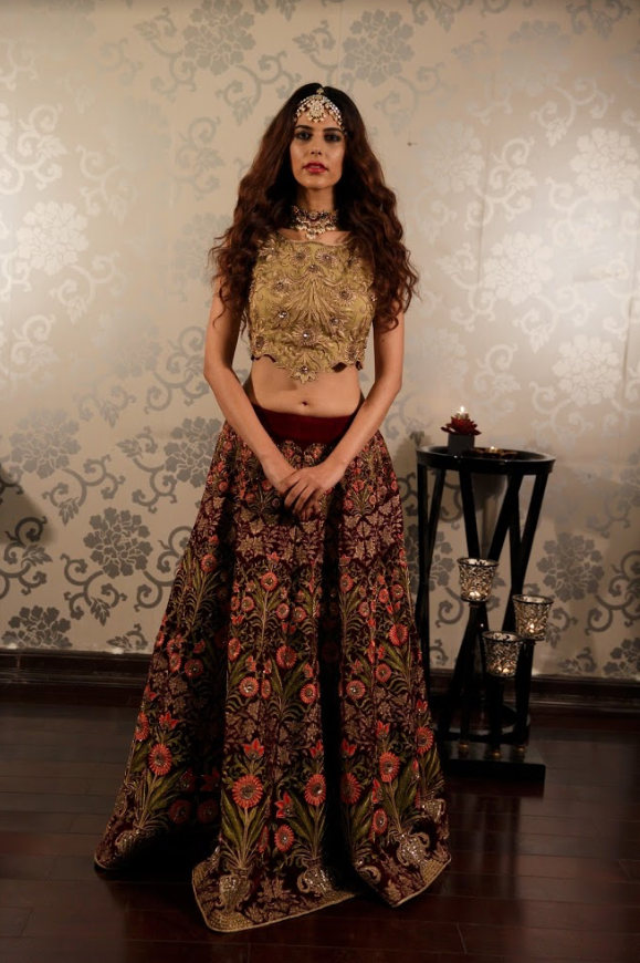 Heavy Embroidered velvet lehenga with a gold blouse