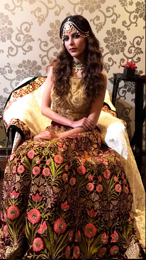 Heavy Embroidered velvet lehenga with a gold blouse